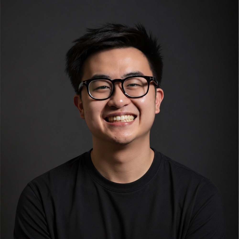 Andrew Tirtha, smiling, in a black t-shirt